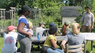 A groups of students and faculty outdoors