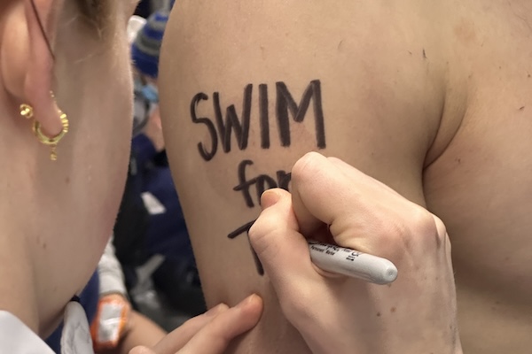 Writing Swim for Tim on the arm