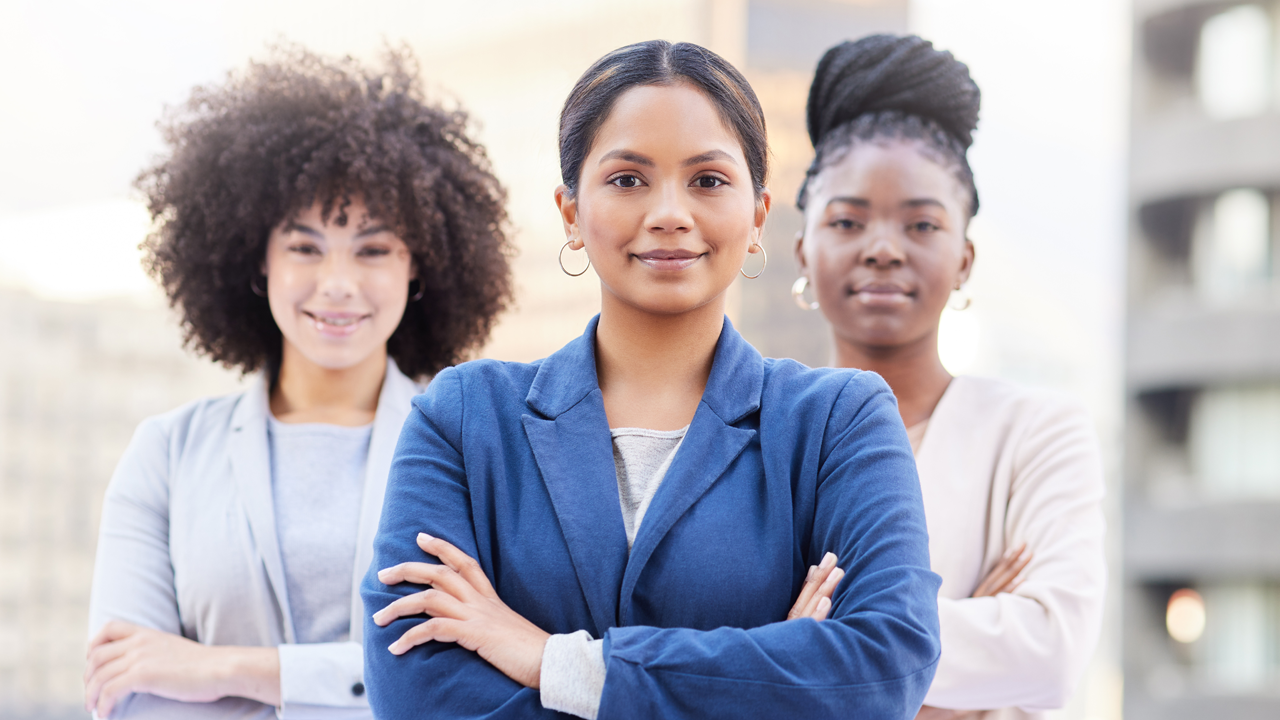 A diverse group of women leaders standing together