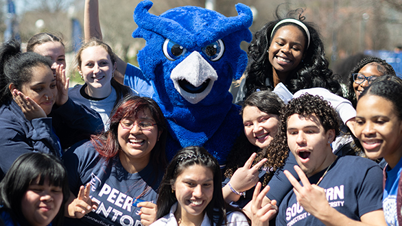 Young adults with Otis the Owl having fun because they followed all the steps