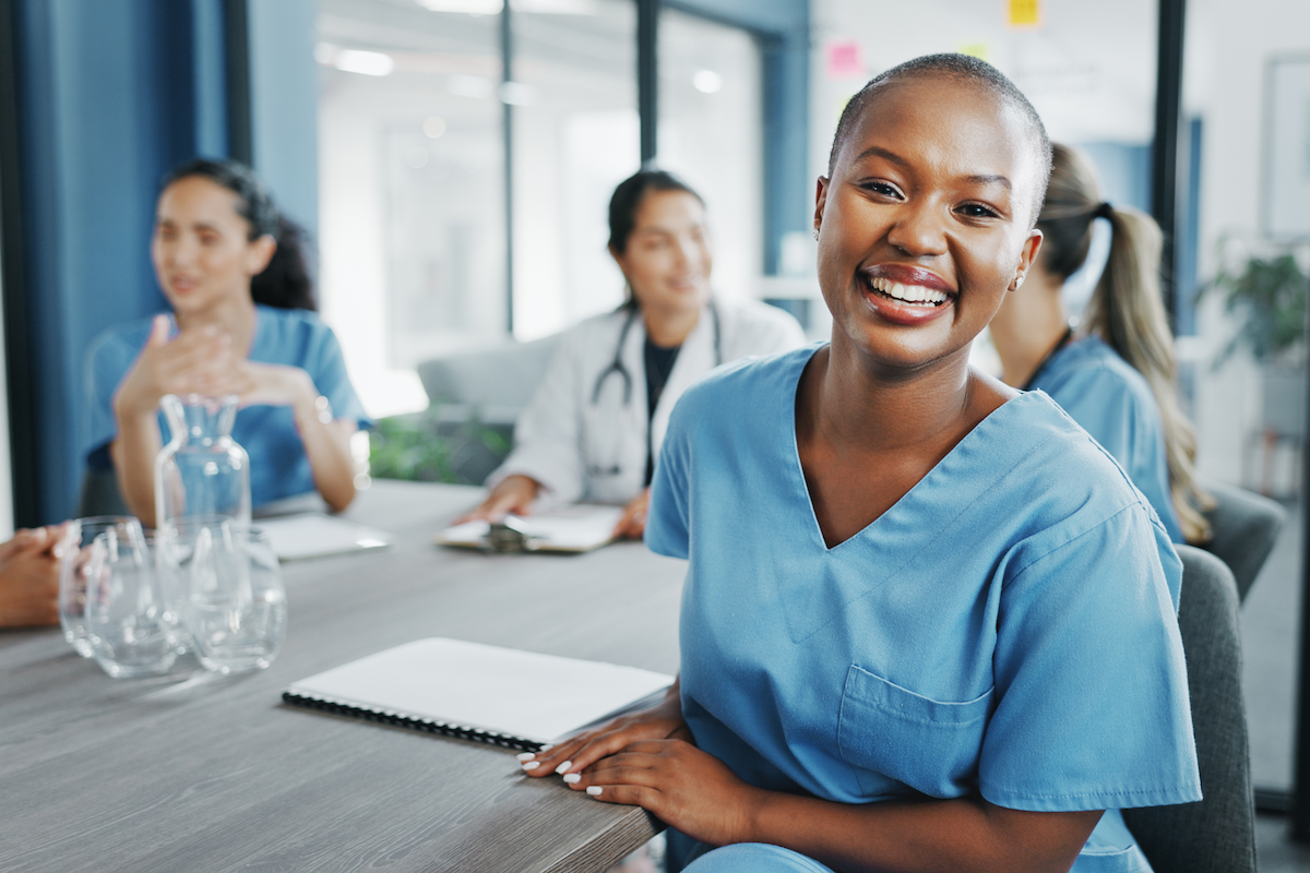 A room of healthcare professionals having a meeting