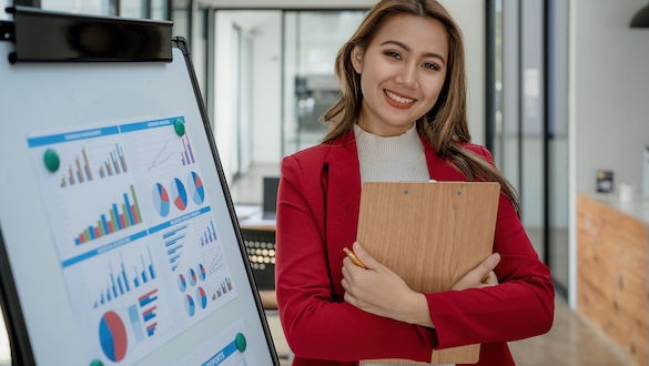 Woman next to a graph