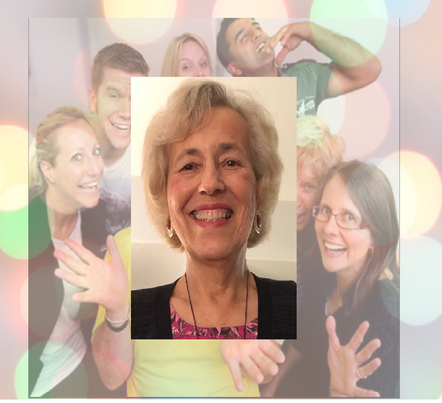 picture of a women surrounded by smiling people in the background