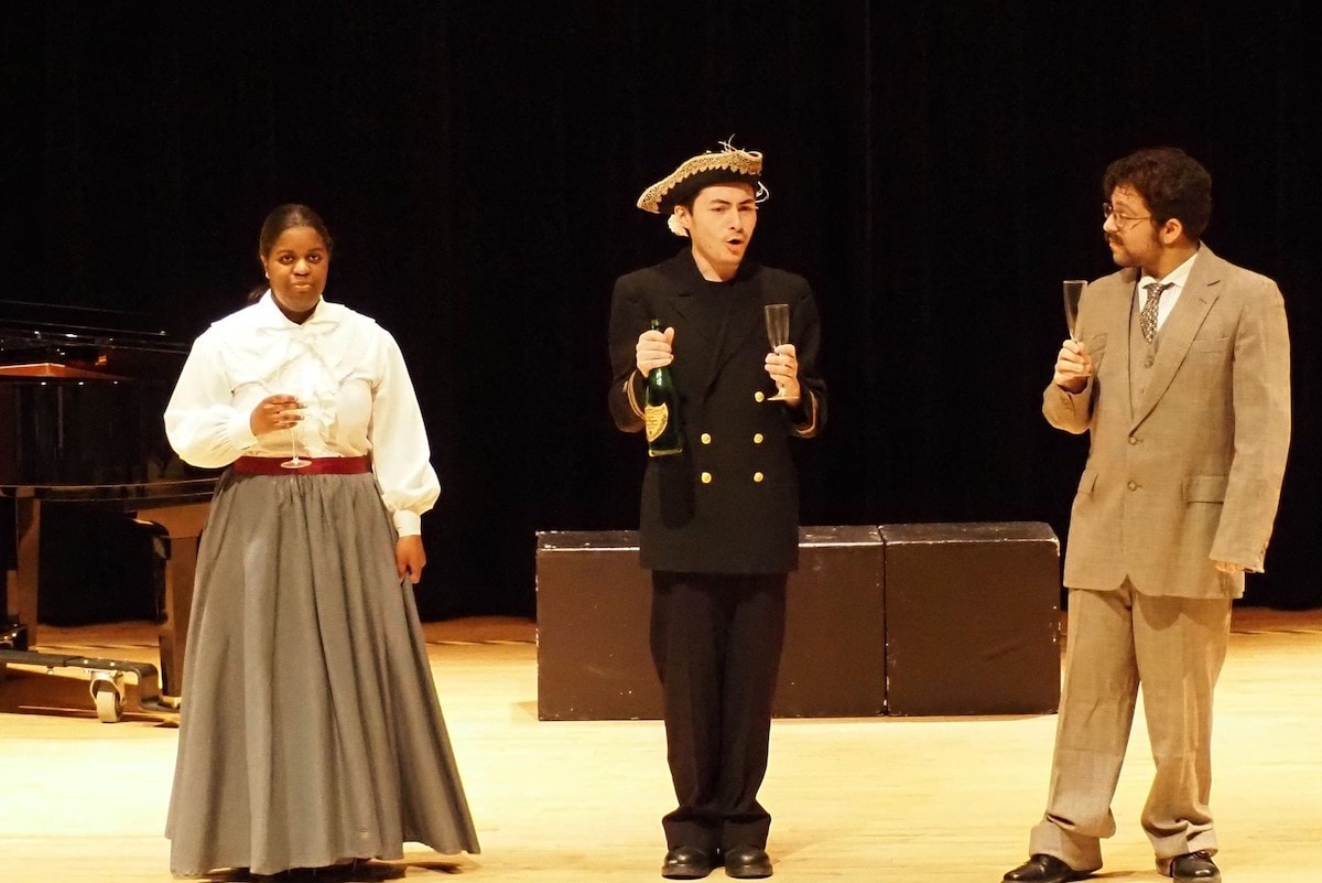 A group of actors performing on stage