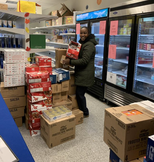 A student helping out at the university food pantry