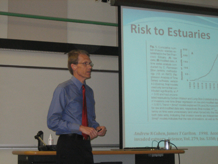 scientist presenting with a powerpoint slide presentaiton