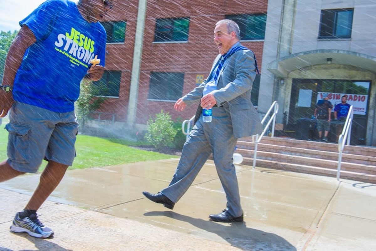 Joe Bertolino splashed by water