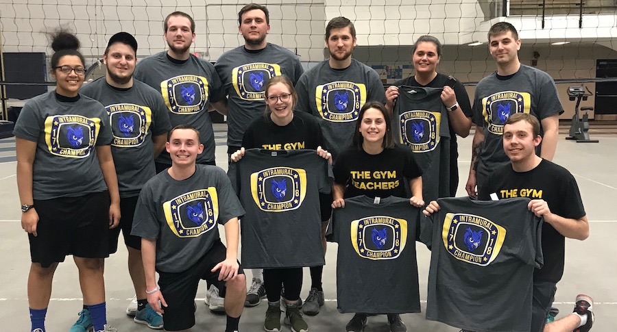 Team holding up intramural champion shirts
