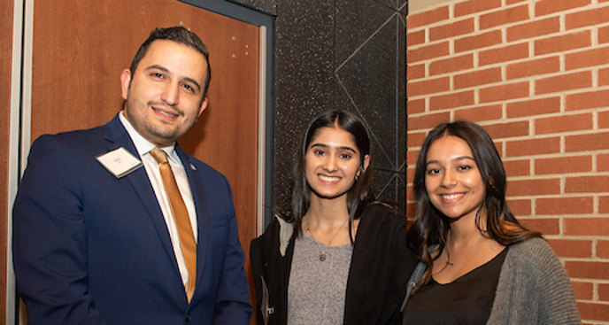 Three students dress in a business attire