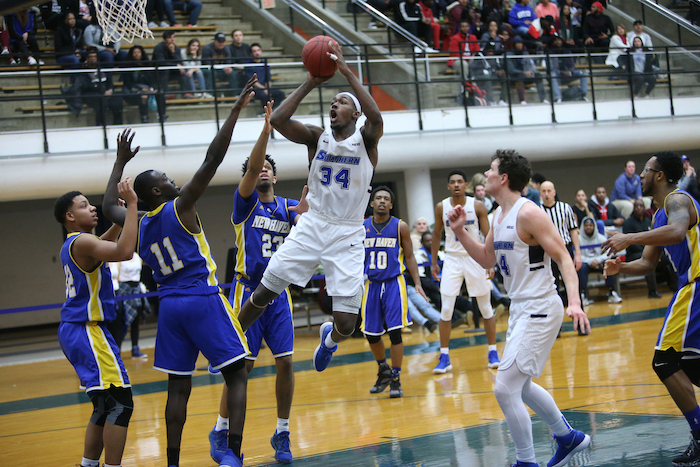 "SCSU men's basketball playing a game"