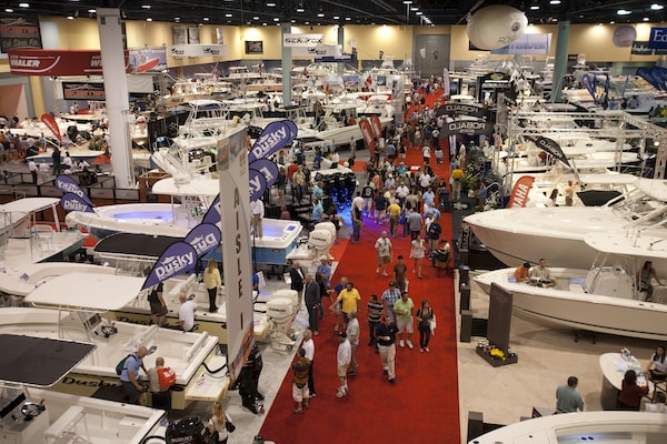 "An expo or conference setting full of people and boats"