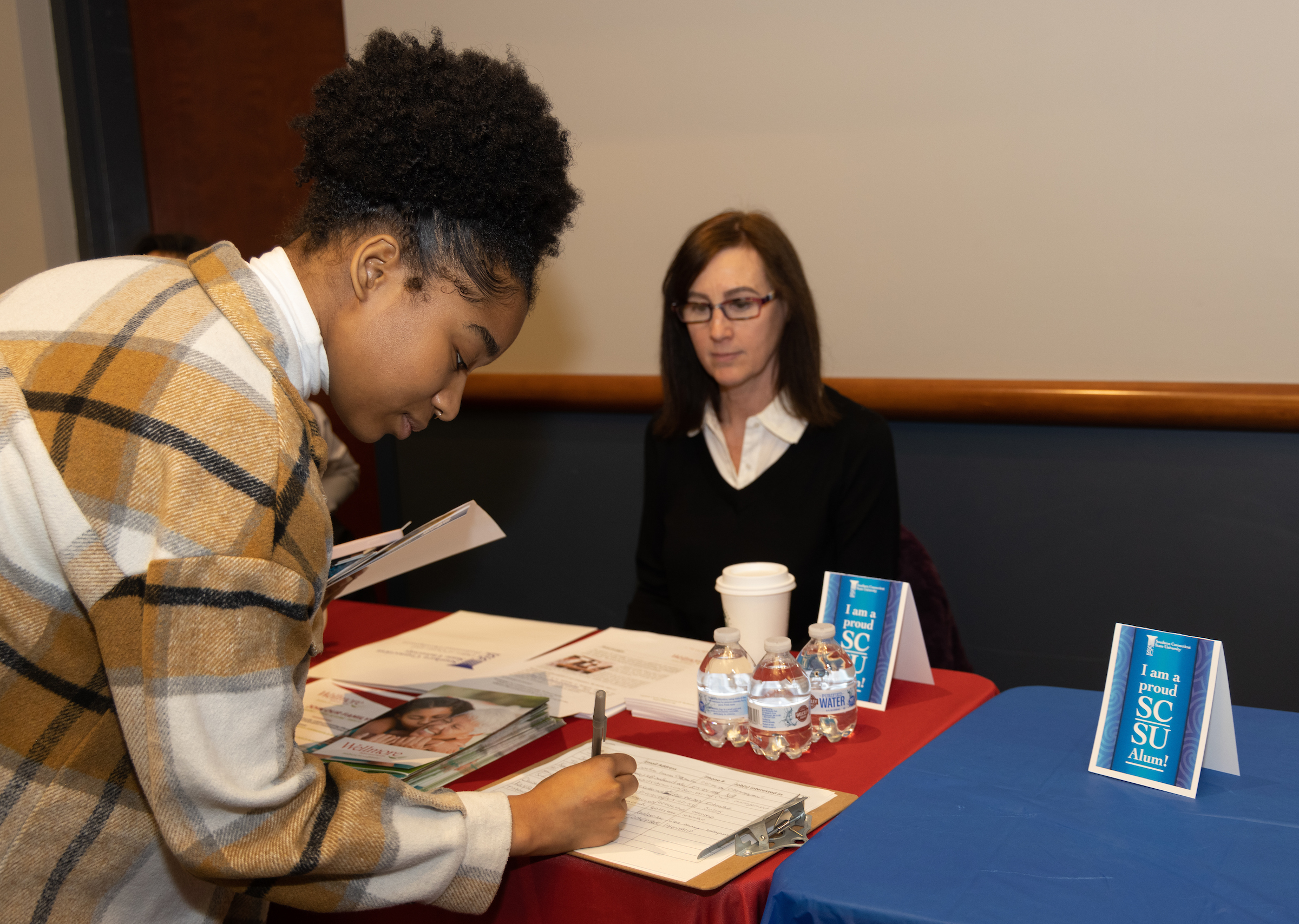 Employer displaying a Proud SCSU Alumni table tent at a hiring event 