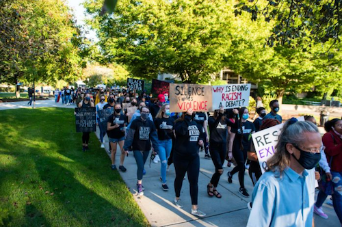 People marching and protesting with signs