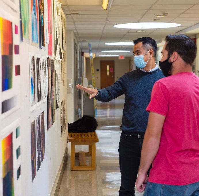 Student viewing artwork in an art gallery