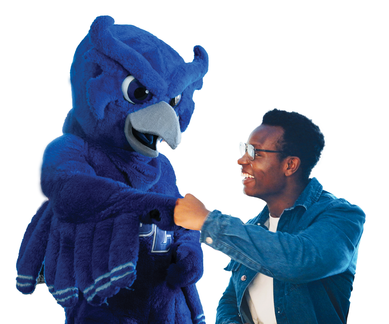 Student fist-bumping the Owl mascot