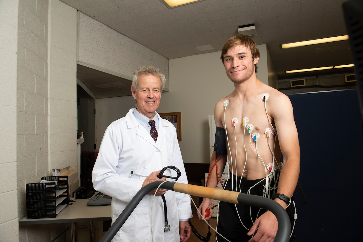 Scientist taking measurements of an athletes