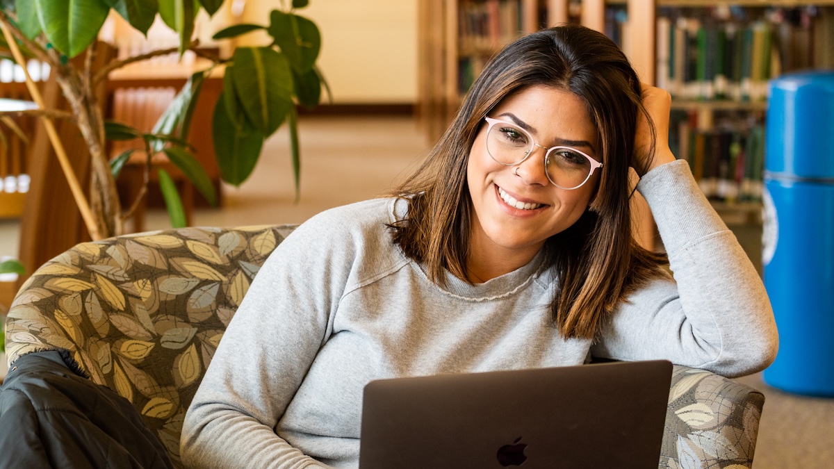 Student smiling with laptop