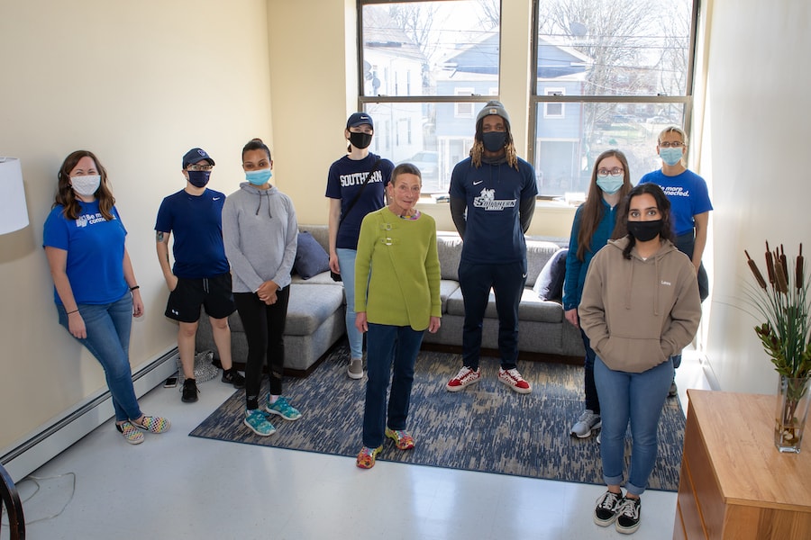 A group of students in an indoor setting wearing face masks