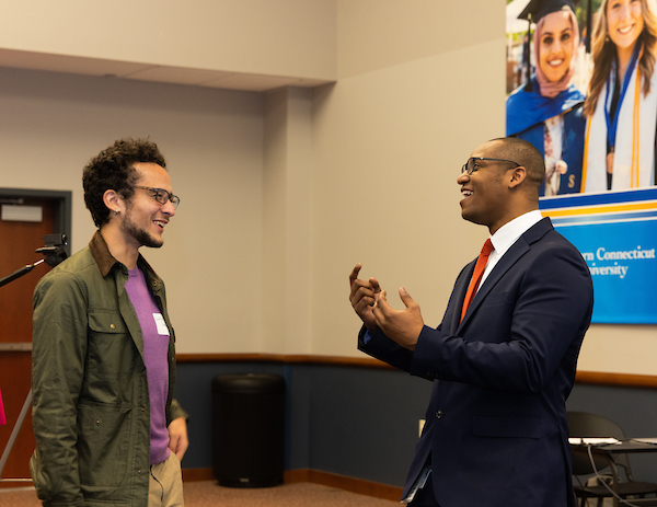 Employer engaging with student during Connecting Students with Professionals of Color