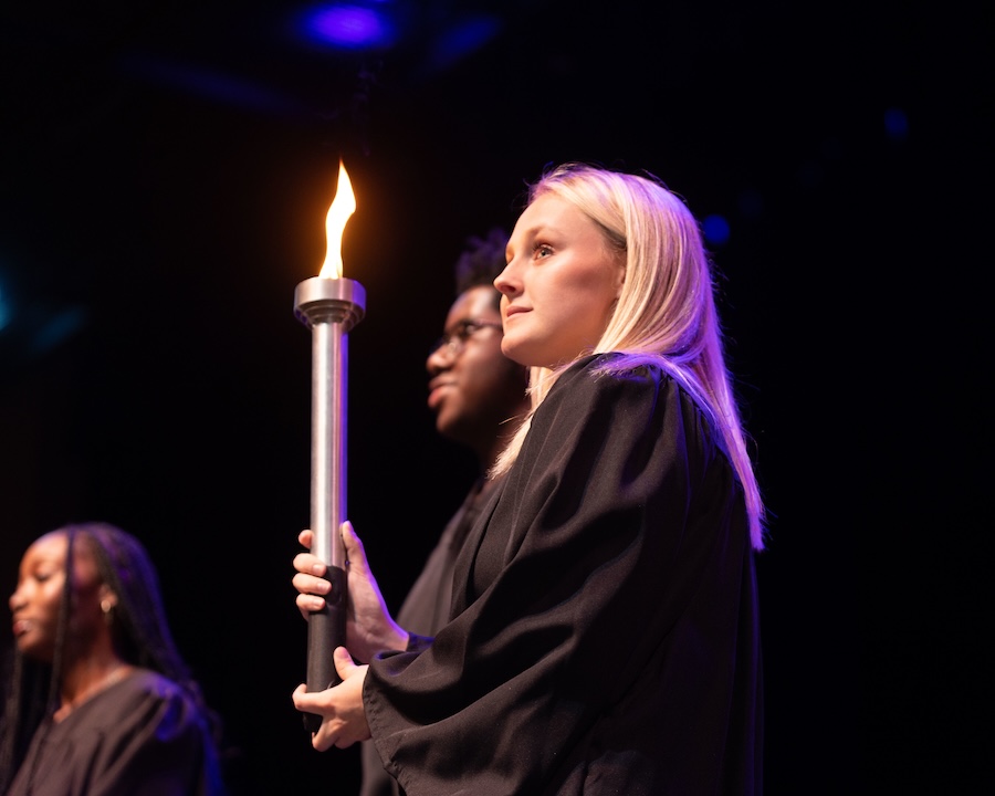 Young woman holding a torch