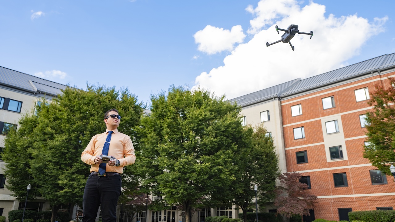 Student flying a drone on Southerns Campus