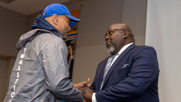 Dr. Dwayne Smith shaking hands with a man