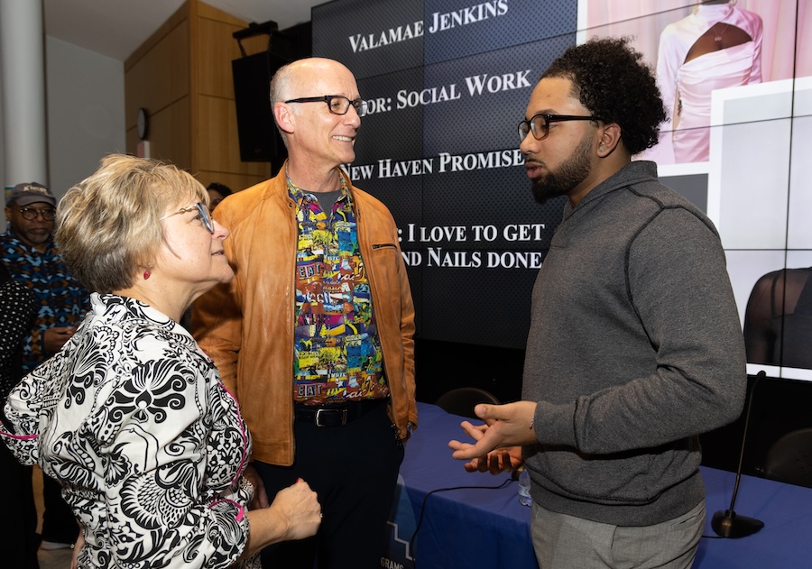 UAP student speaking with two others