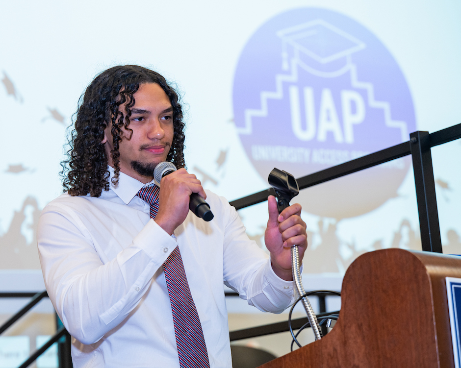 A student speaking on a podium