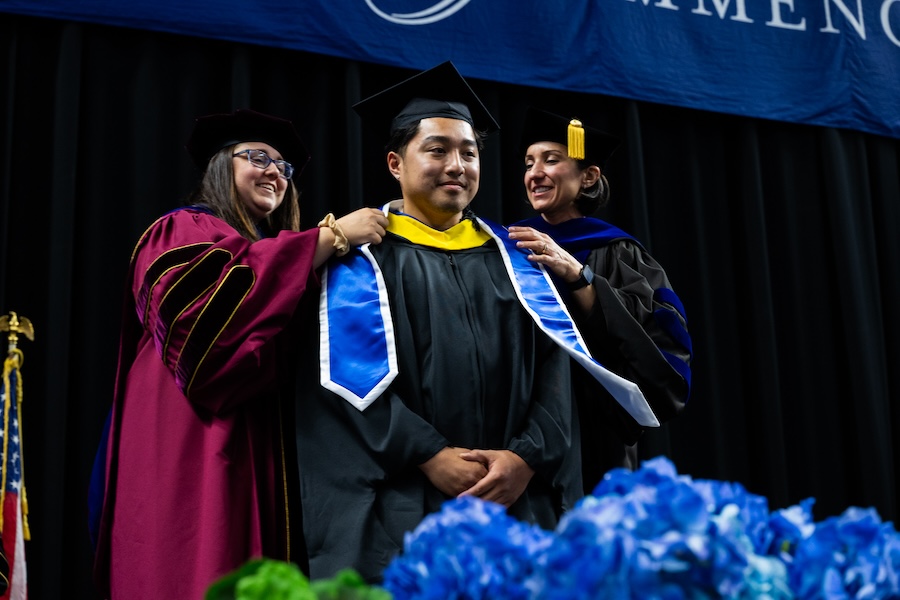 Graduate student at a commencement ceremony