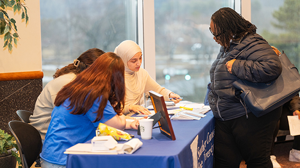 Admission Counselors helping a potential new student