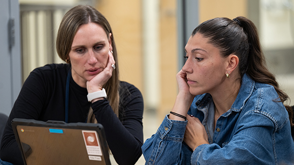 Two Supervisors Carefully Reading the Steps for Hiring a Student Worker