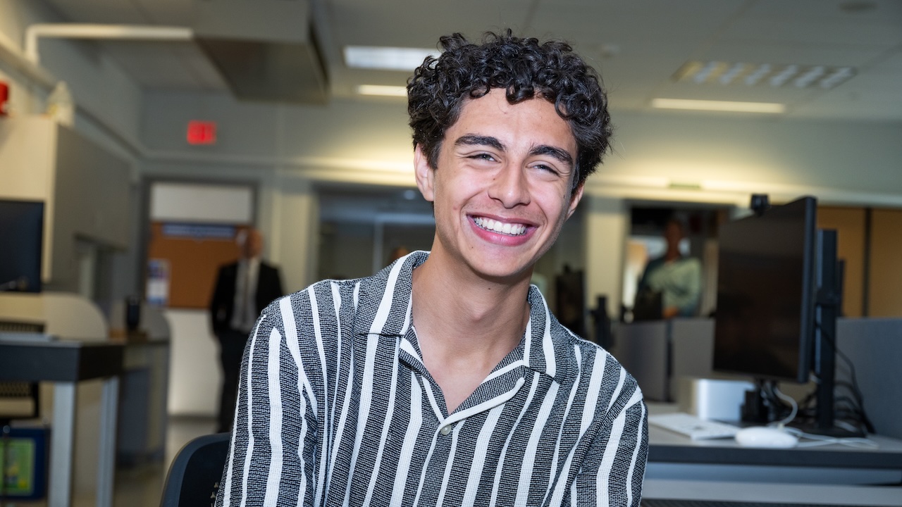 Happy student happy because they completed their enrollment steps