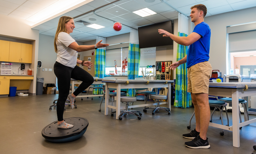 Two people performing a training exercise