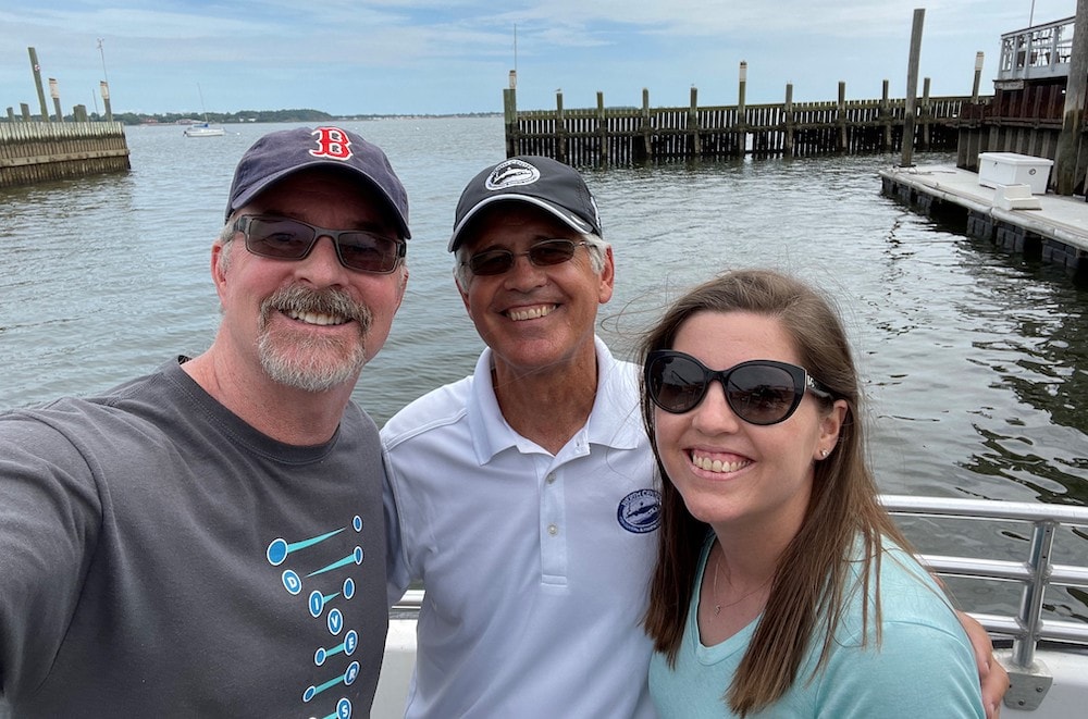 The professors at a Long Island Sound harbor, with LIS in the background