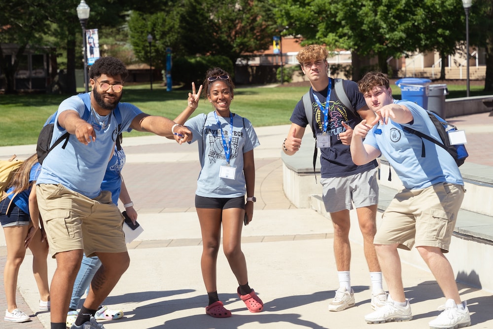 A group of students in orientation making silly poses