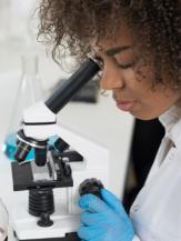 Woman using science equipment