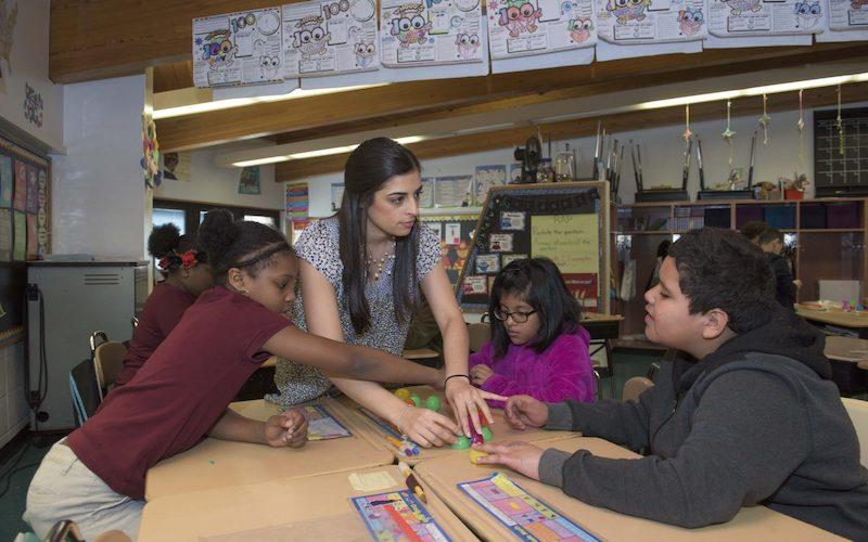 Woman teaching students in a classroom