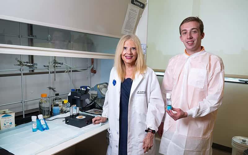 Biology Professor Sarah Crawford and student Connor Poudrie in the lab