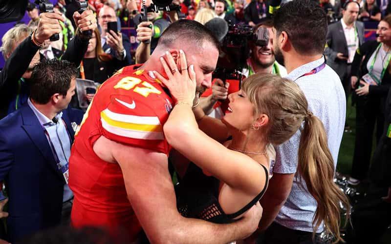 Travis Kelce #87 of the Kansas City Chiefs, celebrates with Taylor Swift after defeating the San Francisco 49ers 25-22 in overtime during Super Bowl LVIII at Allegiant Stadium on February 11, 2024, in Las Vegas, Nevada. (Photo by Ezra Shaw/Getty Images)