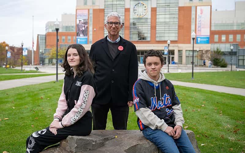 English Professor Andrew Smyth, who is faculty director of Early College, with first-year students Taylor Wilmott (left) and Kai Krieger. 