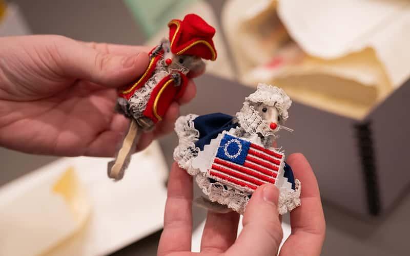 Small patriotic figurines are among the types of “schlock” — everyday commemorative items — Southern students are collecting to study how Americans mark national milestones.