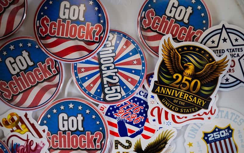 An assortment of red, white, and blue pins and stickers with the message: Got Schlock