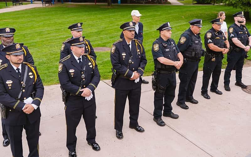 uniformed SCSU police officers stand in a line on the academic quad
