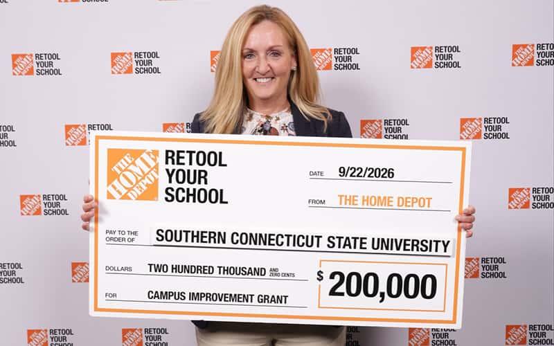 Colleen Bielitz, associate vice president for Strategic Initiatives and Outreach at Southern Connecticut State University, holds a big check for $200,000, representing the campus improvement grant