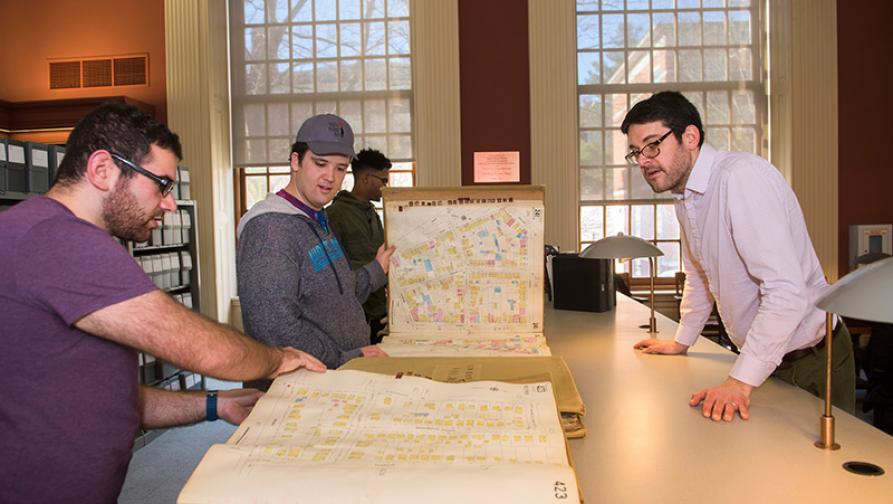 Students looking at maps