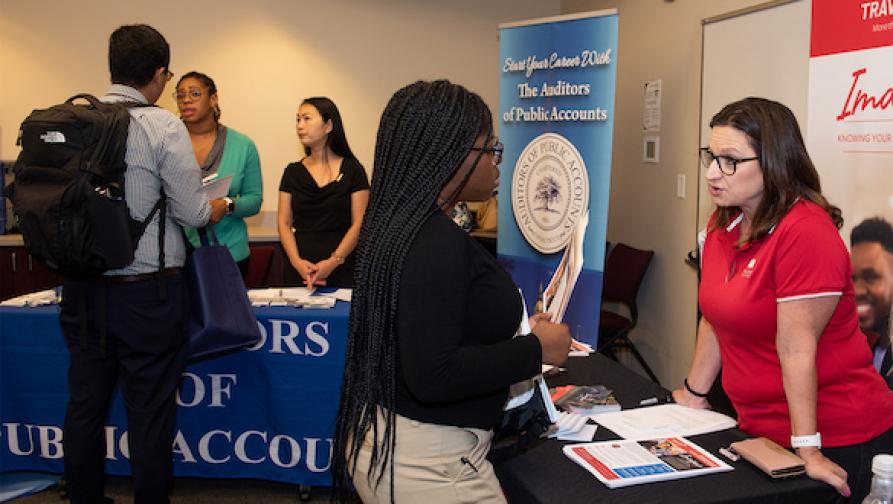 People discussing during a career fair
