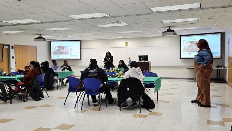 Students in a room with two displays
