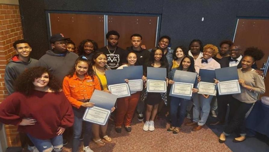 PASS students holding certificates