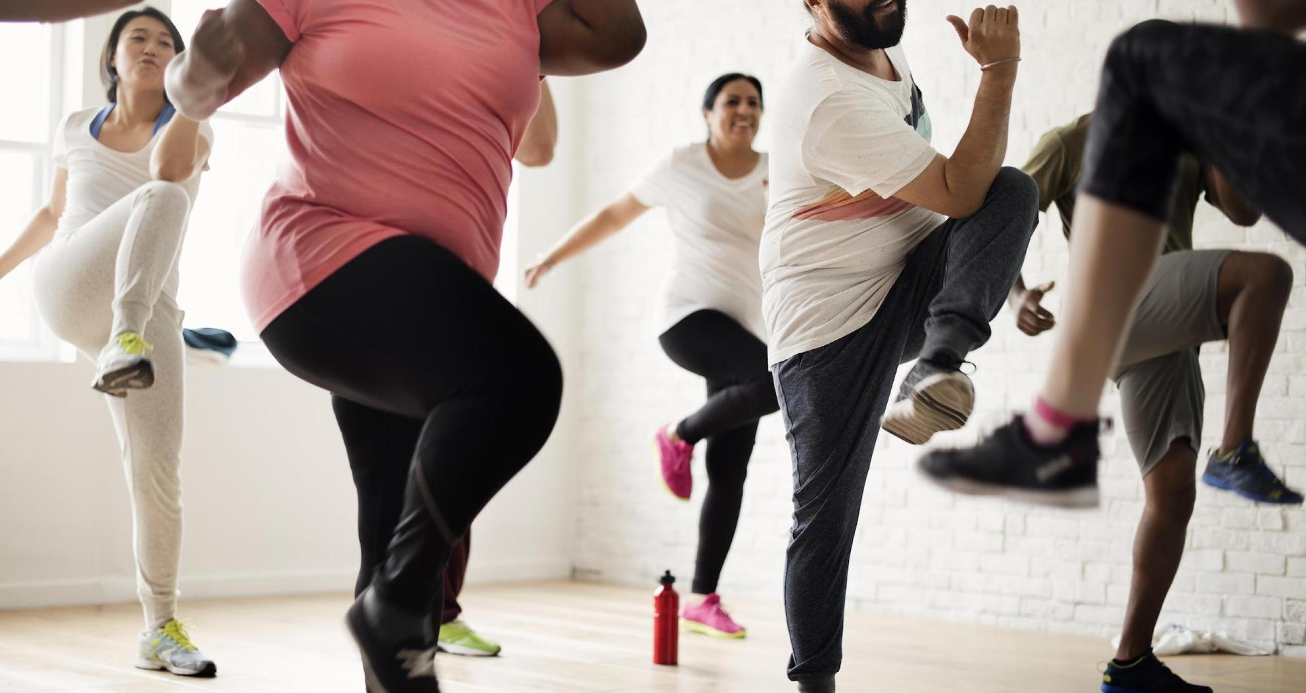 "A group of people exercising"