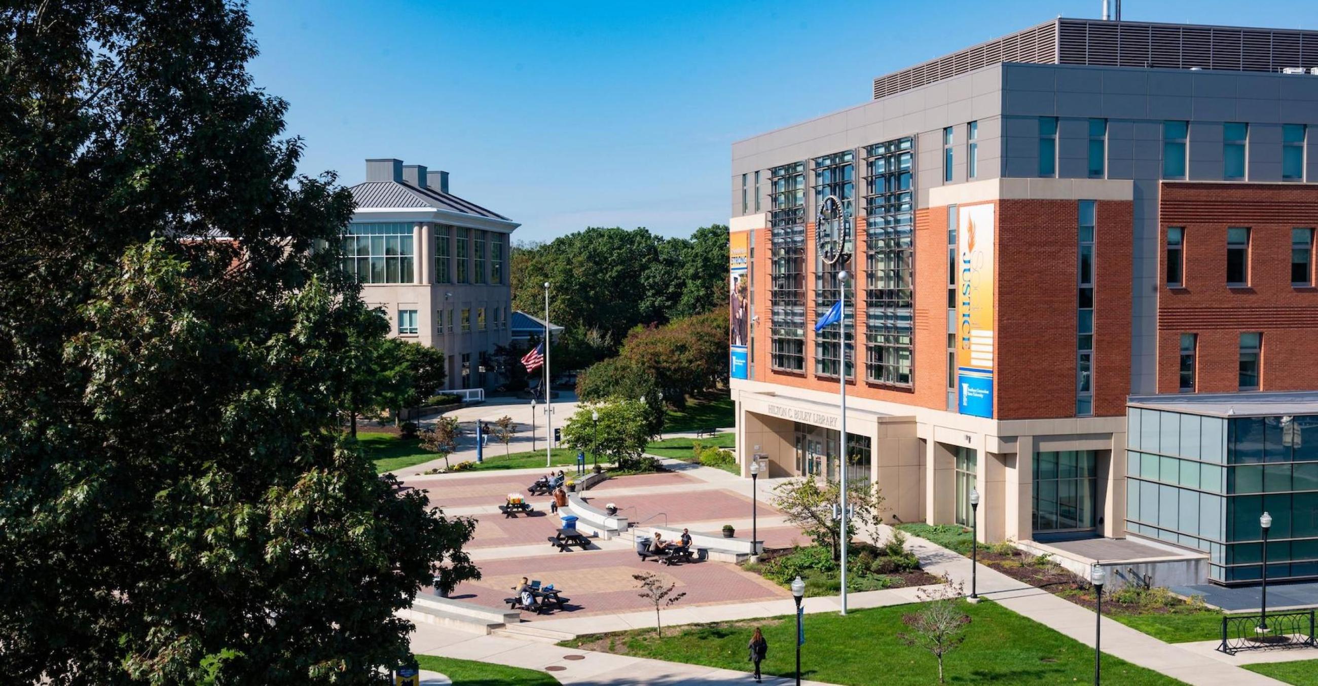 Campus quad with library and student center buildings